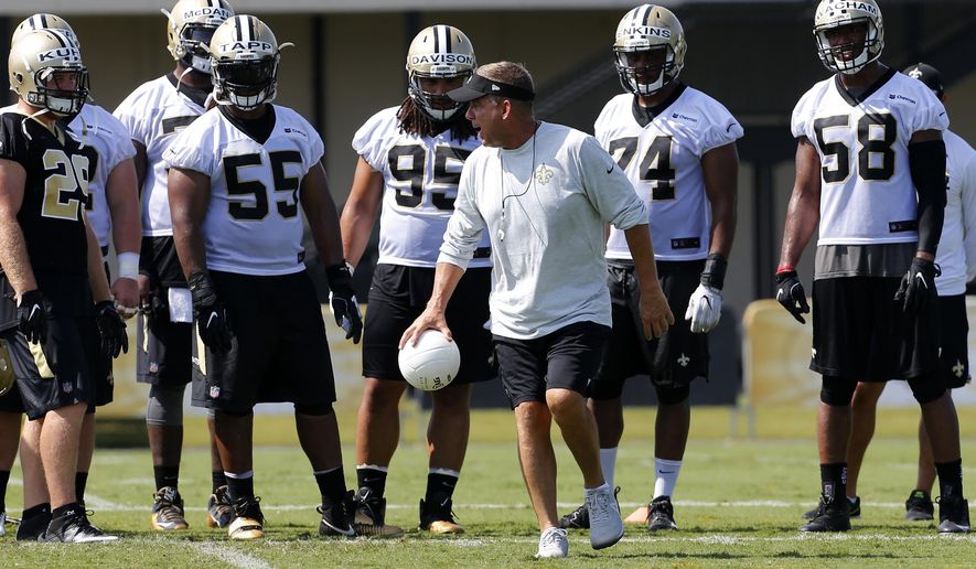 New Orleans Saints head coach Sean Payton directs his players during an NFL football training camp in Metairie, La., Friday, July 28, 2017. (AP Photo/Jonathan Bachman)