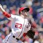 Washington Nationals starting pitcher Erick Fedde throws his first pitch in the Major League during the first inning of a baseball game between the Colorado Rockies and Washington Nationals, Sunday, July 30, 2017, in Washington. (AP Photo/Mark Tenally)