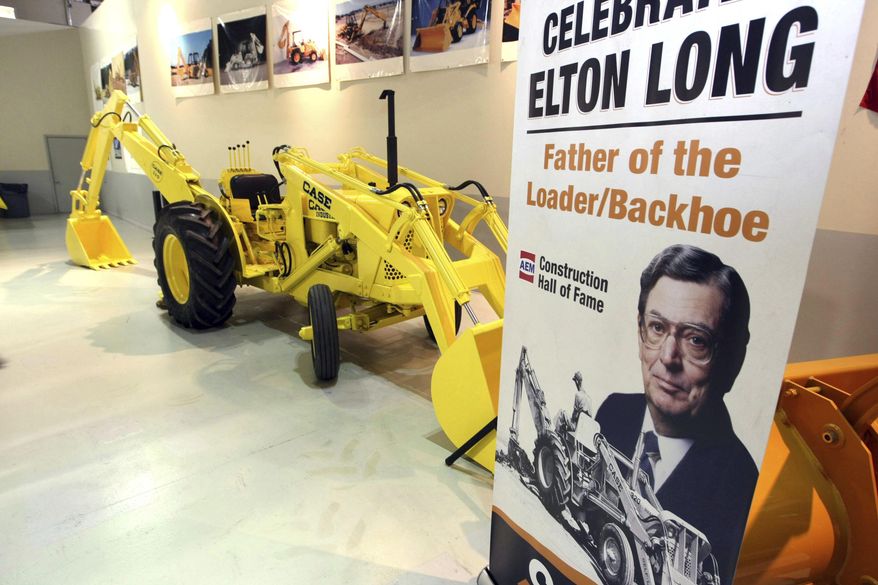 FOR RELEASE SUNDAY, JULY 30, 2017, AT 12:01 A.M. CDT.-In this Nov. 8, 2011, photo a backhoe is seen at an event honoring Elton Long, the father of the backhoe-loader, for his induction into the Construction Equipment Hall of Fame at the visitors center of Case Construction Equipment's Burlington, Iowa, plant. (John Lovretta/The Hawk Eye via AP)
