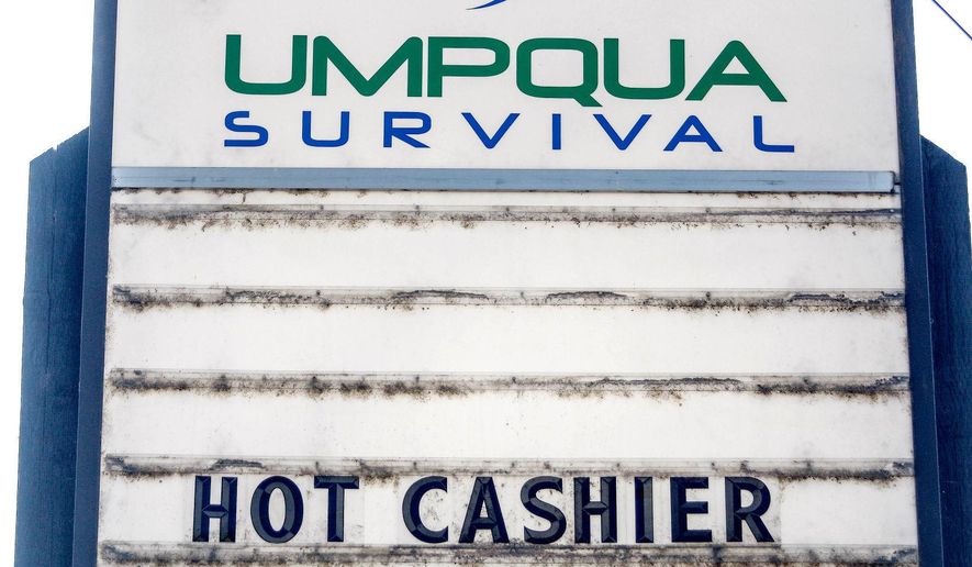 This Monday, July 17, 2017, photo shows a sign outside the Umpqua Survival Store in Roseburg, Ore. (Mike Henneke/The News-Review via AP)