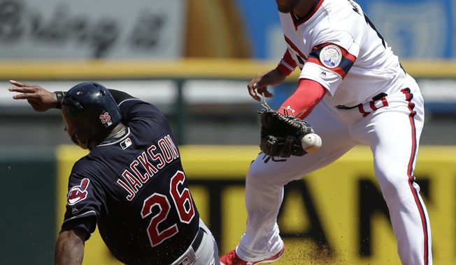 Cleveland Indians&#x27; Austin Jackson, left, steals second base as Chicago White Sox second baseman Yoan Moncada misses the ball during the first inning of a baseball game Sunday, July 30, 2017, in Chicago. (AP Photo/Nam Y. Huh)