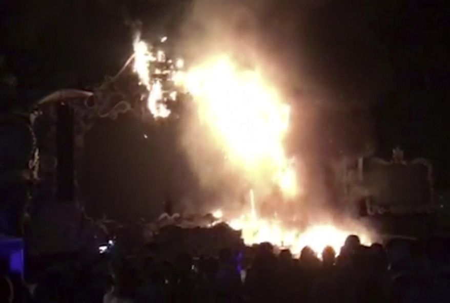In this image made from video provided by David Belmonte, flames engulf the outdoor stage during the "Tomorrowland" electronic music festival in Barcelona, Spain, Saturday night, July 29, 2017. A spectacular fire at the music festival forced the evacuation of over 20,000 concertgoers, the regional government says. (David Belmonte via AP)