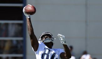 Tennessee Titans wide receiver Corey Davis catches a pass during NFL football training camp Sunday, July 30, 2017, in Nashville, Tenn. (AP Photo/Mark Zaleski)