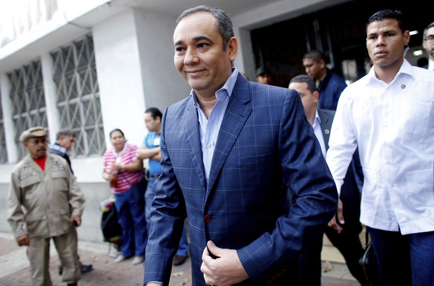 Maikel Moreno, President of Venezuelan Supreme Court leaves a poll station after casting his ballot during constitutional assembly election in Caracas, Venezuela, Sunday, July 30, 2017. (AP Photo/Ariana Cubillos)