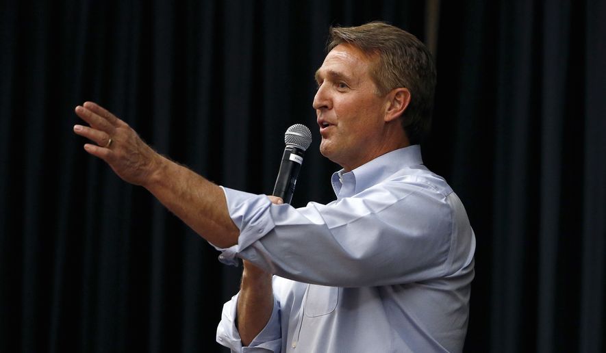 In this April 13, 2017, file photo, Arizona Republican Sen. Jeff Flake takes a question from the audience during a town hall in Mesa, Ariz. The debut of Flake&#x27;s book &quot;Conscience of a Conservative&quot; goes on sale on Tuesday, Aug. 1. (AP Photo/Ross D. Franklin, File)