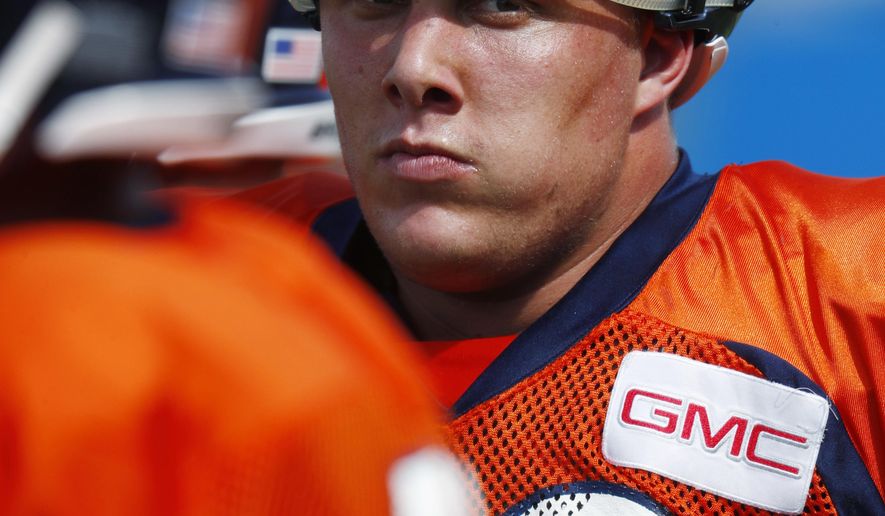 Denver Broncos offensive tackle Garett Bolles takes a break during drills at an NFL football training camp Monday, July 31, 2017, in Englewood, Colo. (AP Photo/David Zalubowski)