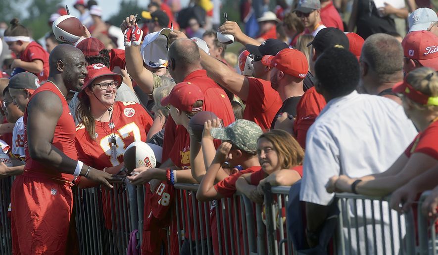 Kansas City Chiefs linebacker Justin Houston poses for a photo with fan Mica Stiffle, 16, of Goddard, Kan., Friday, July 28, 2017, at the NFL football team's training camp in St. Joseph, Mo. (Jessica A. Stewart/The St. Joseph News-Press via AP)