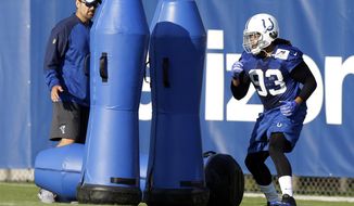 Indianapolis Colts linebacker Jabaal Sheard (93) runs a drill during practice at the NFL team&#x27;s football training camp in Indianapolis, Monday, July 31, 2017. (AP Photo/Michael Conroy)