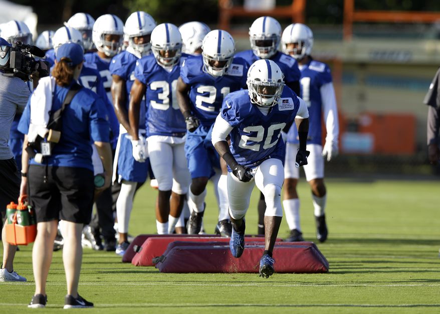 Indianapolis Colts free safety Darius Butler (20) comes over a blocking dummy during practice at the NFL team's football training camp in Indianapolis, Monday, July 31, 2017. (AP Photo/Michael Conroy)