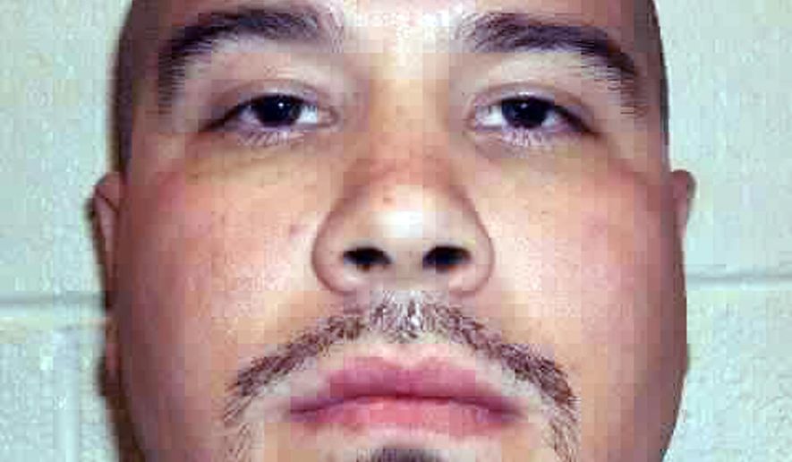 This undated photo provided by the Nevada Department of Corrections in 2017 shows Michael Domingues, 40, who is serving life without parole at Southern Desert Correctional Center outside Las Vegas. Domingues was 16 years old when he strangled his 24-year-old neighbor in Las Vegas and stabbed her 4-year-old son to death in October 1993. He was 17 when he was convicted of double murder and sentenced to be executed. His sentence was converted in 2010 to life without parole. Domingues and his lawyer, Lisa Rasmussen, want the Nevada Supreme Court to rule him constitutionally entitled to a new sentencing hearing at which he could argue that juvenile offenders are too neurologically and psychologically immature to face a lifetime behind bars. A ruling is pending. (Nevada Department of Corrections via AP)