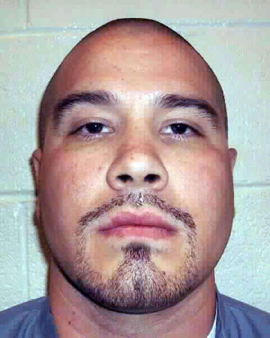 This undated photo provided by the Nevada Department of Corrections in 2017 shows Michael Domingues, 40, who is serving life without parole at Southern Desert Correctional Center outside Las Vegas. Domingues was 16 years old when he strangled his 24-year-old neighbor in Las Vegas and stabbed her 4-year-old son to death in October 1993. He was 17 when he was convicted of double murder and sentenced to be executed. His sentence was converted in 2010 to life without parole. Domingues and his lawyer, Lisa Rasmussen, want the Nevada Supreme Court to rule him constitutionally entitled to a new sentencing hearing at which he could argue that juvenile offenders are too neurologically and psychologically immature to face a lifetime behind bars. A ruling is pending. (Nevada Department of Corrections via AP)