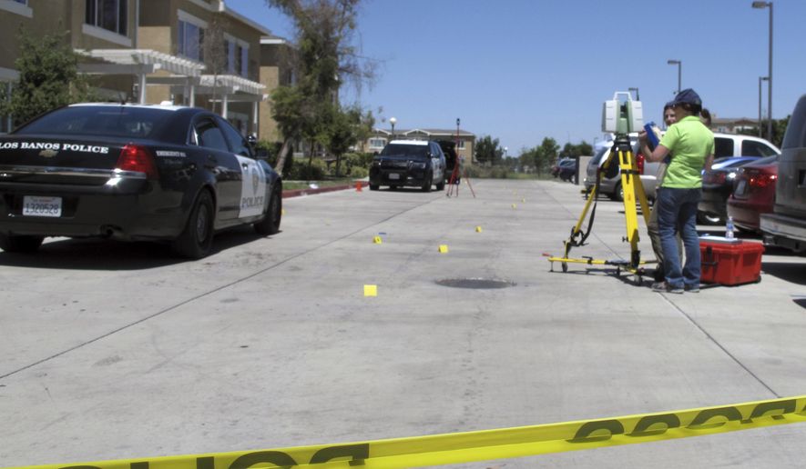 Investigators check a crime scene where two police officers and a burglar were shot on Monday, July 31, 2017, at an apartment complex in Los Banos, Calif. Authorities say the two police officers and a burglary suspect were shot in a struggle that erupted when the officers responded to a break-in report at the apartment. (AP Photo/Scott Smith)