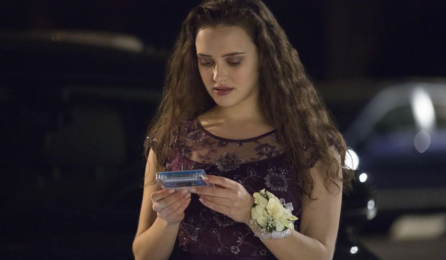 FILE - This file image released by Netflix shows Katherine Langford as Hannah Baker in a scene from the series, "13 Reasons Why." The popular TV series about Baker's suicide that showed her ending her life may have prompted a surge in online searches for suicide, including how to do it, according to a new study published Monday, July 31, 2017, in JAMA Internal Medicine. (Beth Dubber/Netflix via AP, File)