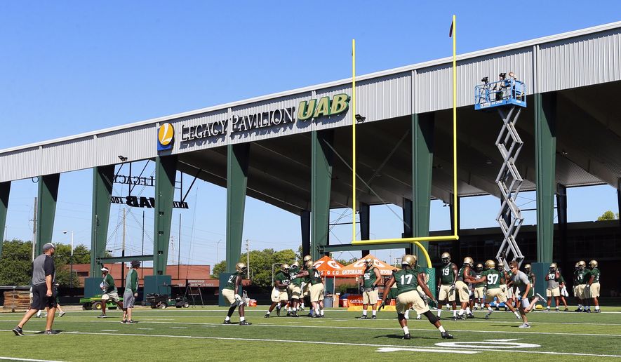 Players practice on the first day back as UAB's football program starts up again after two years, Monday, July 31, 2017, in Birmingham, Ala. (AP Photo/Butch Dill)