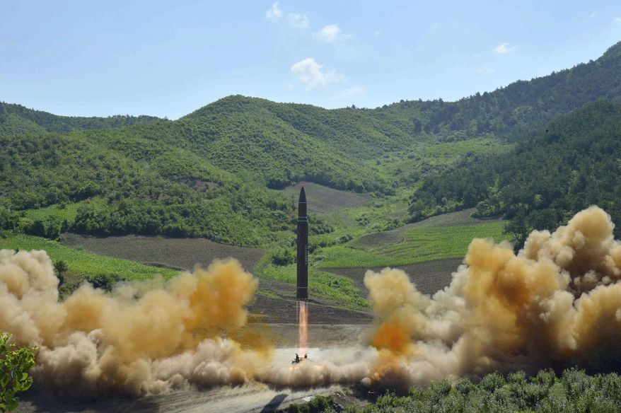 FILE- In this July 4, 2017, file photo distributed by the North Korean government shows what was said to be the launch of a Hwasong-14 intercontinental ballistic missile, ICBM, in North Korea's northwest. North Korea has been condemned and sanctioned for its nuclear ambitions, yet has still received food, fuel and other aid from its neighbors and adversaries for decades. How does the small, isolated country keep getting what it wants and needs to prevent its collapse? (Korean Central News Agency/Korea News Service via AP, File)
