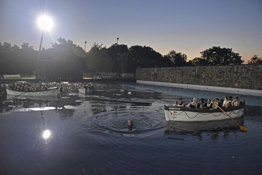 The set of "Unsinkable," a movie about the Titanic, is seen at dawn on Tuesday, Aug. 1, 2017, at the Settler's Cabin Wave Pool in Pittsburgh. “Unsinkable,” an independent film project that follows the story of what happened to survivors of the 1912 Titanic disaster, is shooting closed-set scenes for the next three nights at Settler’s Cabin wave pool Tuesday in the South Hills and at North Park pool Wednesday and Thursday. (Anna Spoerre/Pittsburgh Post-Gazette via AP)