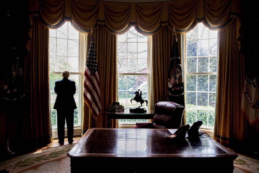 In this photo taken April 21, 2017, file photo, President Donald Trump looks out an Oval Office window at the White House in Washington following an interview with The Associated Press. (AP Photo/Andrew Harnik)&#x27; ** FILE **