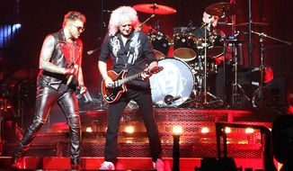 Adam Lambert, guitarist Brian May and drummer Roger Taylor celebrate the music of Queen at the Verizon Center. (Photograph by Joseph Szadkowski / The Washington Times)