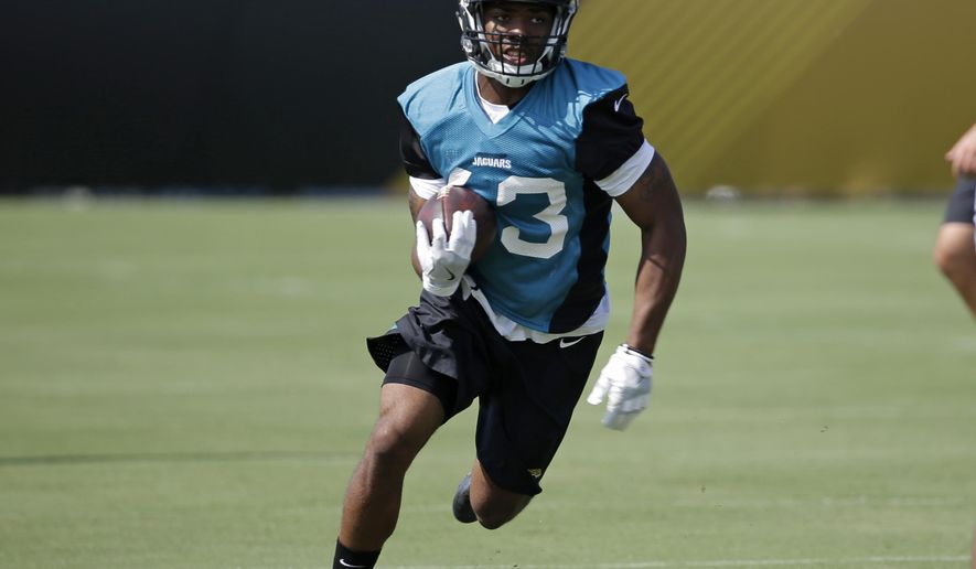 FILE - In this July 28, 2017, file photo, Jacksonville Jaguars running back I'Tavius Mathers (43) runs through a drill during NFL football training camp, in Jacksonville, Fla. Mathers will be released from the hospital a day after suffering a neck injury during practice. The team says Mathers will return to the football facility Wednesday, Aug. 2, 2017, and the medical staff will work with him to "decide the best course of action for his recovery."(AP Photo/John Raoux, File)
