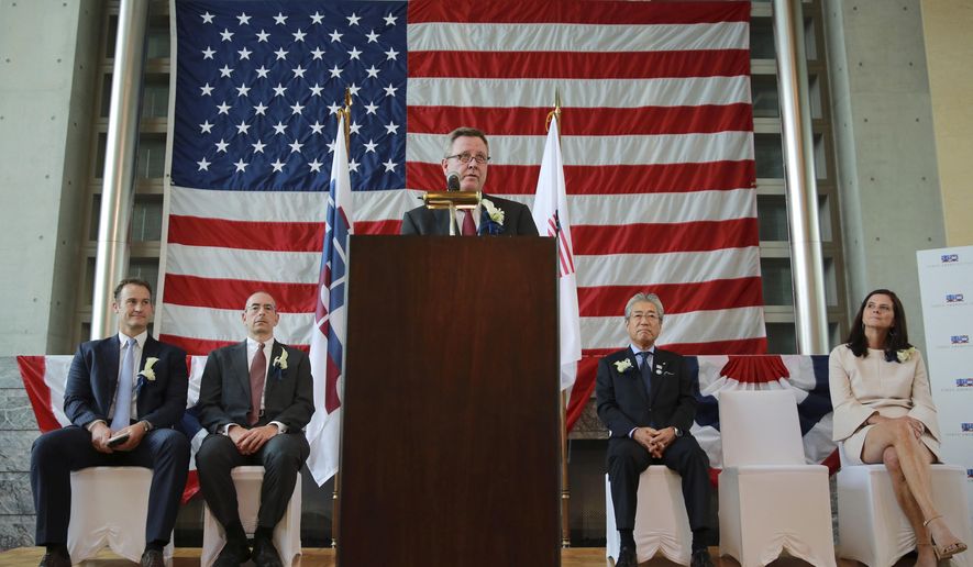 U.S. Olympic Committee CEO Scott Blackmun speaks as he is accompanied by USOC chief marketing officer Lisa Baird, right, Tsunekazu Takeda, second right, president of the Japanese Olympic Committee, Tokyo American Club (TAC) Representative Governor Michael Alfant, second left, and TAC Olympic Committee Chair Dean Rogers, left, at Tokyo American Club in Tokyo Wednesday, Aug. 2, 2017. The U.S. Olympic team will be based at the Tokyo American Club during the 2020 Tokyo Olympics, USOC officials announced on Wednesday. (AP Photo/Eugene Hoshiko)