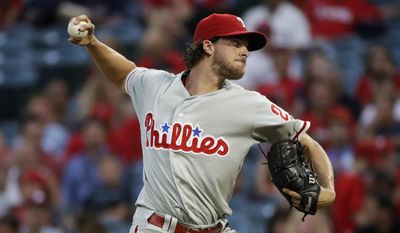 Philadelphia Phillies starting pitcher Aaron Nola throws to a Los Angeles Angels batter during the first inning of a baseball game, Tuesday, Aug. 1, 2017, in Anaheim, Calif. (AP Photo/Jae C. Hong)