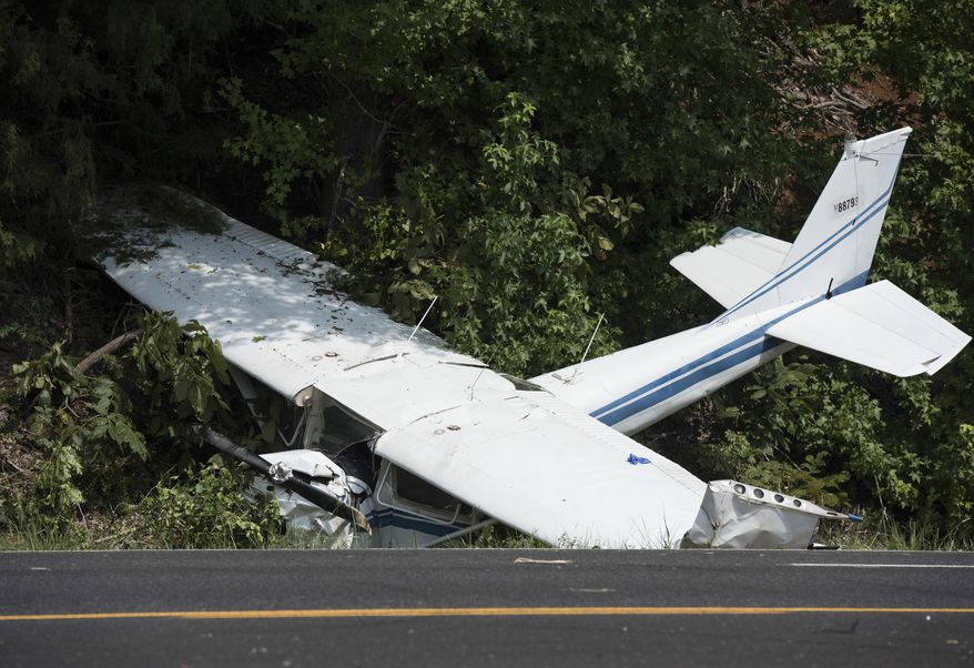 A downed aircraft lays off the shoulder of U.S. Highway 69, north of Mount Selman, Texas, Tuesday, Aug. 1, 2017. The small engine plane had two occupants. Injuries are unknown at this time, according to an email from The Texas Department of Public Safety. (Sarah A. Miller/Tyler Morning Telegraph via AP)