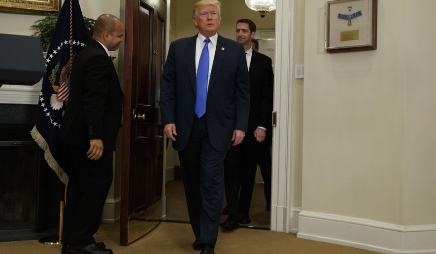 President Donald Trump, followed by Sen. Tom Cotton, R-Ark., arrives in the Roosevelt Room of the White House in Washington, Wednesday, Aug. 2, 2017, to unveil legislation that would place new limits on legal immigration. (AP Photo/Evan Vucci)