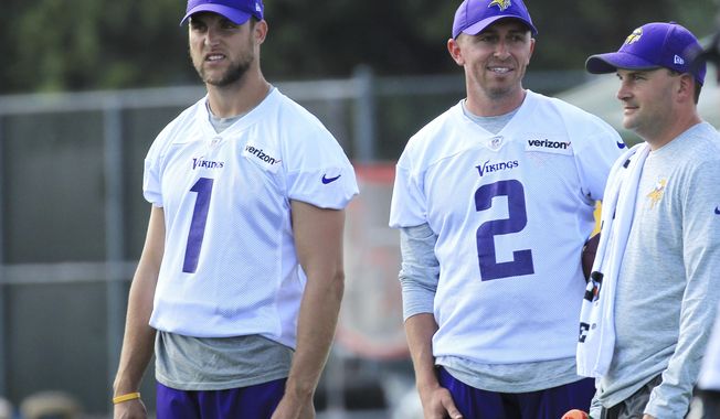 FILE - In this July 27, 2017, file photo, Minnesota Vikings kicker Marshall Koehn (1) and Vikings kicker Kai Forbath (2) watch practice during NFL football training camp,in Mankato, Minn. After the Vikings made a midseason switch from Blair Walsh last year, Kai Forbath came in and made all of his field goal tries. But he has not been given the job for 2017 yet. Marshall Koehn is trying to take it. Person at right is unidentified. (AP Photo/Andy Clayton-King)
