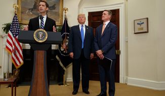 &quot;We want to welcome talented individuals from around the world who wish to come to the United States legally,&quot; said Sen. David Perdue (right). (Associated Press)