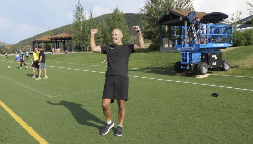 In this July 11, 2017, still image from video, veteran referee Howard Webb, who is overseeing the MLS implementation of Video Assistant Referee, reacts on the sidelines following a video replay scrimmage, in Park City, Utah. Games were staged as part of the final training camp to gauge MLS referees' competence in and comfort with video replay. (AP Photo/Rick Bowmer)