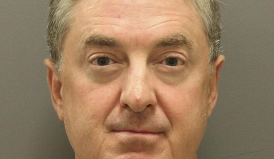 This photo released Wednesday, Aug. 3, 2017, by the Denton, Texas, Police Department department, shows Michael Lee Bush. Police the North Texas parole officer has been accused of getting hydrocodone pills from a convict he was overseeing. Denton police say the 52-year-old was arrested Tuesday on a charge of possession of a controlled substance after allegedly receiving the prescription pain killer from a parolee. (Denton Police Department via AP)