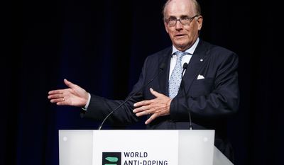 FILE - This is a Monday March 13, 2017 file photo of lawyer Richard McLaren, investigator and report author for the world anti-doping agency , WADA, as he delivers his speech addressing his findings on Russian State-Sponsored doping systems during the opening day of the 2017 world anti-doping agency annual symposium, at the Swiss Tech Convention Center, in Lausanne, Switzerland.  The World Anti-Doping Agency says the Russian government must accept the findings of a report which accused it of overseeing widespread doping and a cover-up. Last year’s report by WADA investigator Richard McLaren said Russian Sports Ministry officials decided which athletes to “save” by covering up failed drug tests, and swapped samples containing banned substances at the 2014 Winter Olympics (Valentin Flauraud/Keystone, File via AP)