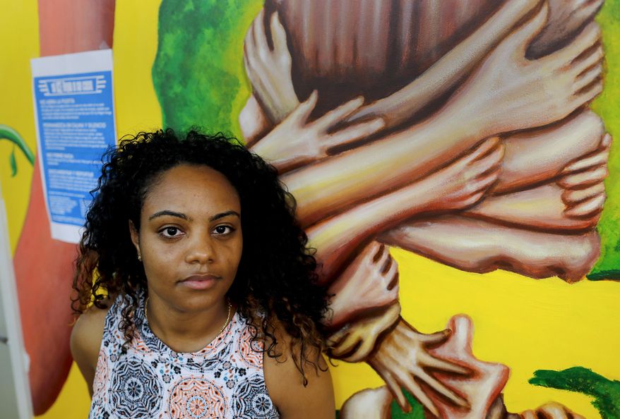 Yaritza Mendez, a citywide outreach coordinator for the non-profit Make the Road New York, stands for a photo at the organization's office, Thursday, Aug. 3, 2017, in New York. With changes in proposed legislation that would shift the country from a family-based immigration system to one that gives preference to skilled workers over family connections, Mendez, who is also attempting to petition for her mother to live in the U.S., and organizations like Make the Road, are staying busy advising clients seeking help in navigating the system. (AP Photo/Julie Jacobson)