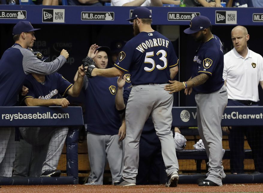 Milwaukee Brewers starting pitcher Brandon Woodruff (53) is congratulated by teammates after being taken out of the baseball game against the Tampa Bay Rays during the seventh inning Friday, Aug. 4, 2017, in St. Petersburg, Fla. (AP Photo/Chris O&#39;Meara)