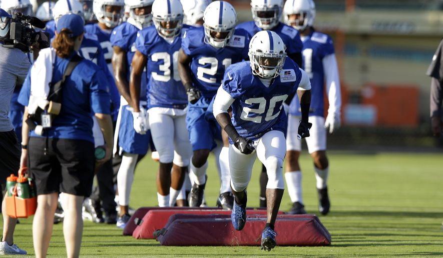 FILE - In this July 31, 2017, file photo, Indianapolis Colts free safety Darius Butler (20) runs over a blocking dummy during practice at the NFL team's football training camp in Indianapolis. New Indianapolis Colts general manager Chris Ballard started his overhaul on defense. Now, a litttle more than a month away from the regular season, the Colts are looking at a younger, bigger, feistier unit that could include six or more new starters. (AP Photo/Michael Conroy, File)