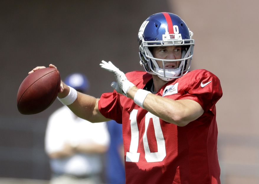 New York Giants quarterback Eli Manning throws a pass during NFL football training camp, Thursday, Aug. 3, 2017, in East Rutherford, N.J. (AP Photo/Julio Cortez)