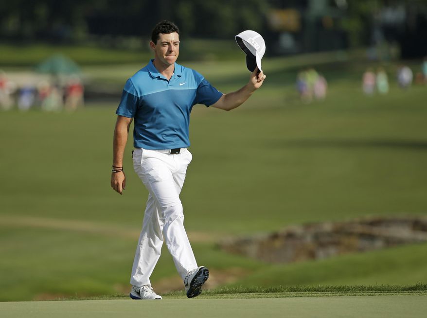 FILE - In this May 17, 2015, file photo, Rory McIlroy, of Northern Ireland, tips his cap to the crowd as he walks up to the 18th green before winning the Wells Fargo Championship golf tournament at Quail Hollow Club in Charlotte, N.C. McIlroy hasn&#39;t won all year, and he split with his caddie after the British Open. In a year without a victory, how would he measure his season if he were to win the PGA Championship?  (AP Photo/Chuck Burton, File)