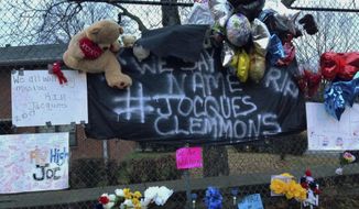 FILE - In this Feb. 14, 2017, file photo, a memorial is set up in a neighborhood where Nashville Officer Josh Lippert shot Jocques Scott Clemmons in Nashville, Tenn. Federal officials on Friday, Aug. 4, 2017, agreed with a state decision not to prosecute Lipper, a white Tennessee police officer, who fatally shot Clemmons,  a black man, after a traffic stop. (AP Photo/Jonathan Mattise, File)