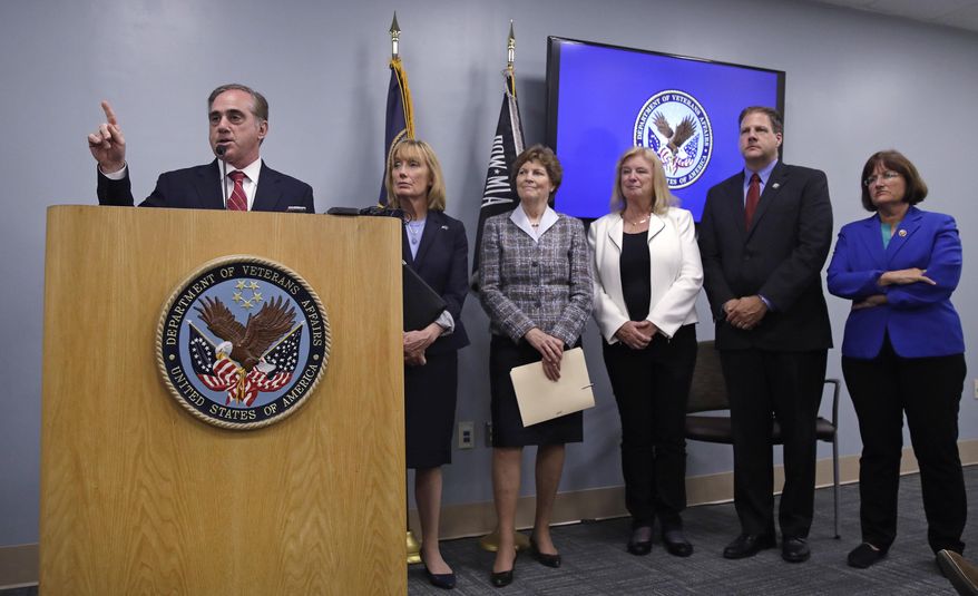 Secretary of Veterans Affairs David J. Shulkin, left, gestures as he addresses reporters during a visit to the Veterans Administration Medical Center in, Manchester, N.H., Friday, Aug. 4, 2017. Shulkin earlier met privately with doctors at the center, who have alleged substandard care at New Hampshire's only hospital for veterans. From left are Shulkin, U.S. Sen. Maggie Hassan, D-N.H., U.S. Sen. Jeanne Shaheen, U.S. Rep. Carol Shea-Porter, D-N.H., N.H. Gov. Chris Sununu and U.S. Rep. Annie Kuster, D-N.H. (AP Photo/Charles Krupa)
