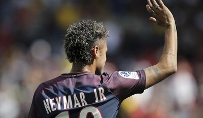 Brazilian soccer star Neymar waves to fans, at the Parc des Princes stadium in Paris, Saturday, Aug. 5, 2017, during his official presentation to fans ahead of Paris Saint-Germain&#39;s season opening match against Amiens. Paris Saint-Germain fans got their first chance to see Neymar inside the Parc des Princes but the world&#39;s most expensive player left the pitch after 24 minutes. Neymar cannot play as the club did not receive his international transfer certificate before Friday night&#39;s deadline despite his 222 million-euro ($262 million) move from Barcelona being completed the previous day. (AP Photo/Kamil Zihnioglu)
