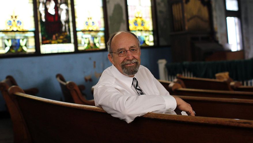 Ron Luce, treasurer of the preservation society, poses for a portrait at Mount Zion Baptist Church on Carpenter Street in Athens, Ohio on Aug. 1, 2017. The Mount Zion Preservation Society has recently been granted ownership of the church and plan on restoring it to it's former beauty. [Brooke LaValley/The Columbus Dispatch via AP)