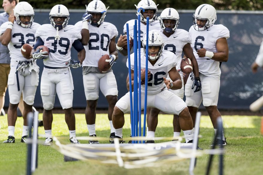 Penn State running back Saquon Barkley runs a drill during NCAA college football practice Saturday, Aug. 5, 2017, in State College, Pa. (Joe Hermitt/PennLive.com via AP)