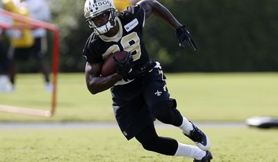 This July 28, 2017 photo shows New Orleans Saints running back Adrian Peterson (28) running with the ball during an NFL football training camp in Metairie, La. Peterson is still waiting to show off the renowned physical aspect of his game with his new team because there has been only minimal tackling allowed at Saints training camp so far. Still, he appears healthy and his presence has New Orleans’ offense optimistic about the dynamic he’ll add to an already potent scheme. (AP Photo/Jonathan Bachman)