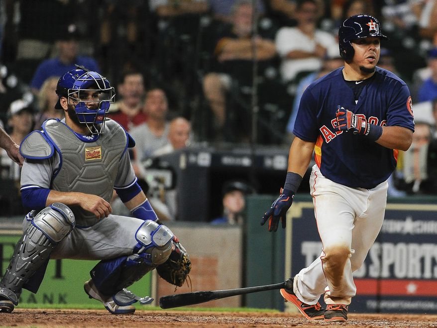 Houston Astros' Juan Centeno hits a winning single during the ninth inning of a baseball game against the Toronto Blue Jays, Sunday, Aug. 6, 2017, in Houston. (AP Photo/Eric Christian Smith)