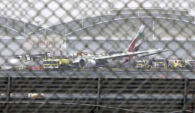 FILE- In this Wednesday, Aug 3, 2016 file photo, a damaged Boeing 777 is seen at the Dubai airport after it crash-landed, in Dubai, United Arab Emirates. Investigators said Sunday no mechanical issues affected an Emirates flight before it crash landed in Dubai and burst into flames last year, as their probe continues to look at &amp;quot;human performance factors&amp;quot; around the inciden. (AP Photo/Jon Gambrell, file)