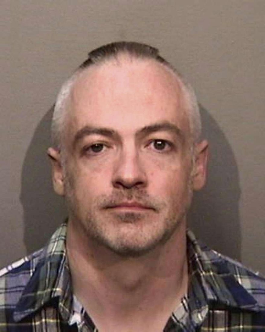 This undated photo released by the Alameda County, Calif., Sheriff&#39;s Office shows Wyndham Lathem, an associate professor of microbiology at Northwestern University. Lathem and Andrew Warren, an employee of the University of Oxford in Britain, were jailed in the San Francisco area in connection with the death of a young hairdresser in Chicago, police said. Lathem faces a Monday, Aug. 7, 2017, court appearance in the city of Pleasanton, Calif. (Alameda County Sheriff&#39;s Office via AP)