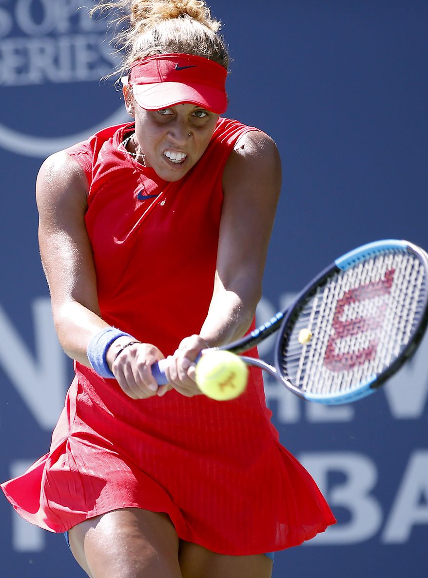 Madison Keys, of the United States, returns a forehand to compatriot Coco Vandeweghe during the finals of the Bank of the West Classic tennis tournament in Stanford, Calif., Sunday, Aug. 6, 2017. (AP Photo/Tony Avelar)
