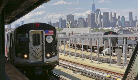 In this June 21, 2017 file photo, a subway train approaches the platform at Brooklyn&#39;s Smith Street above-ground subway station, in New York. (AP Photo/Bebeto Matthews, File)