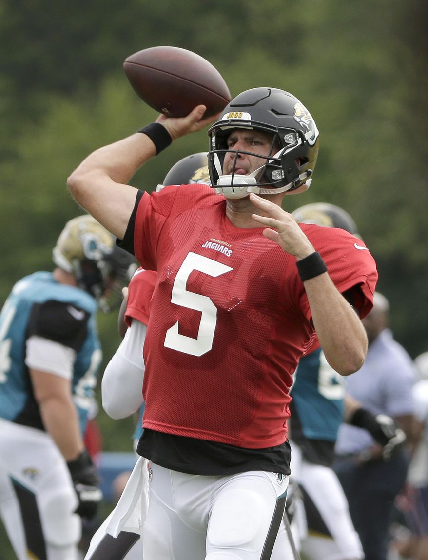 Jacksonville Jaguars quarterback Blake Bortles winds up for a pass during an NFL football joint practice with the New England Patriots, Monday, Aug. 7, 2017, in Foxborough, Mass. (AP Photo/Steven Senne)