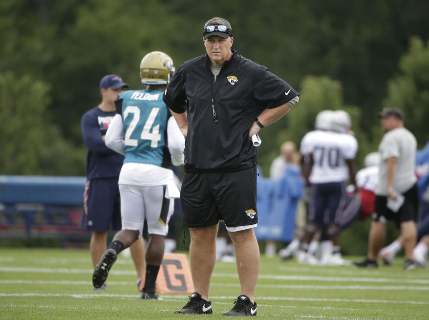 Jacksonville Jaguars head coach Doug Marrone stands on the field during an NFL football joint practice with the New England Patriots, Monday, Aug. 7, 2017, in Foxborough, Mass. (AP Photo/Steven Senne)